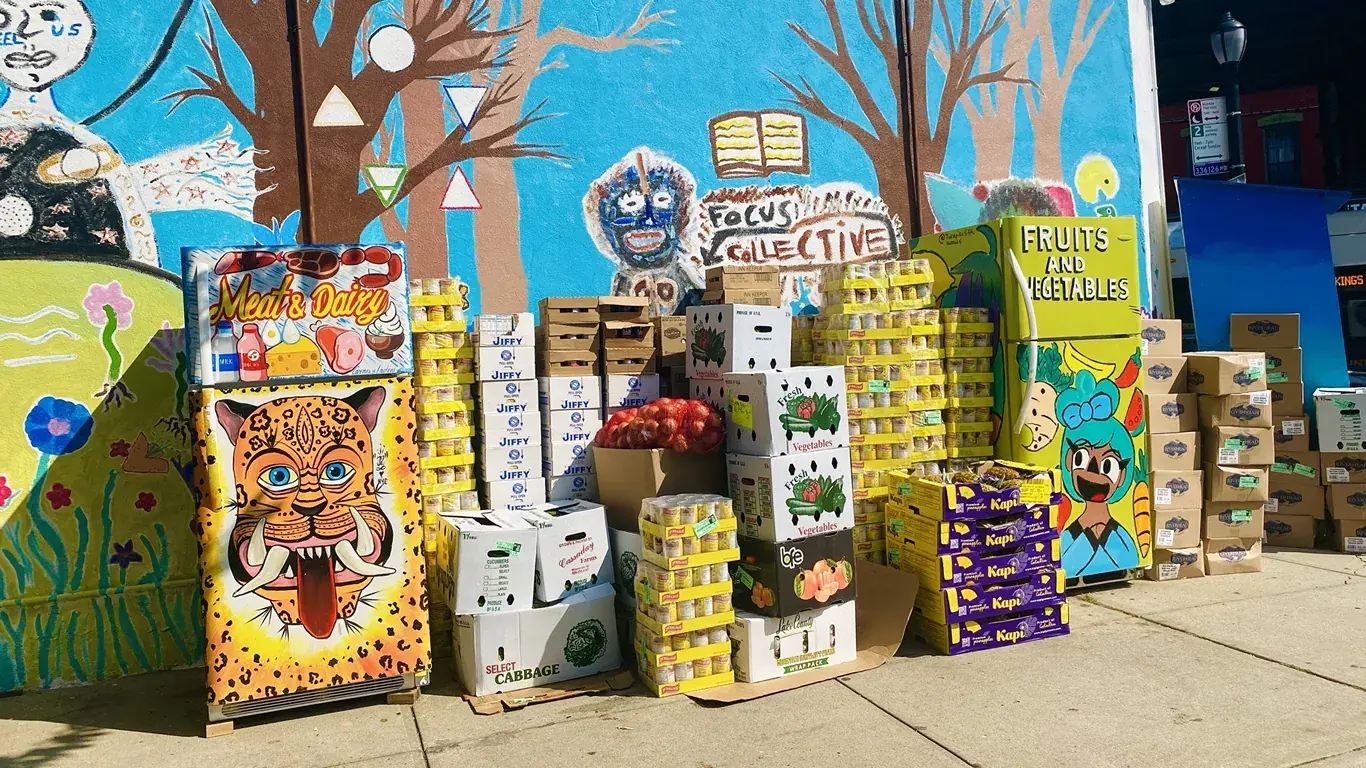 Boxes of food stacked up in front of Community Focus